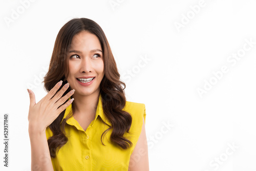 Beautiful long hair asian woman smiling and looking up isolated on white background.