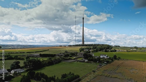 Drone footage of Emley Moor transmitting station, is a telecommunications and broadcasting. The iconic concrete tower is 1 is a Grade II listed. It is the tallest freestanding structure in the UK photo