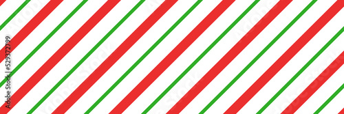 Christmas candy cane striped seamless pattern. Christmas candycane background with red and green stripes. Peppermint caramel diagonal print. Xmas traditional wrapping texture. Vector illustration.