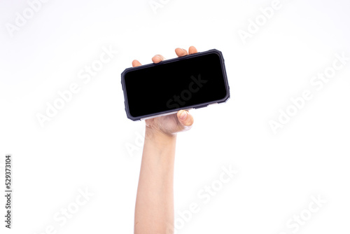 Blank screen with copy space, child hand with smart phone isolated on white photo