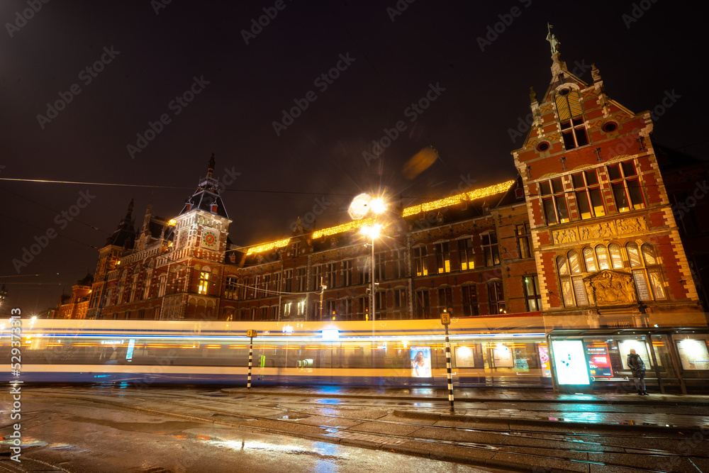 Amsterdam train station during early morning before sunrise , Amsterdam , Netherlands : November 27 ,  2019