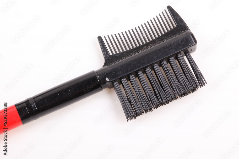 Black Comb and Brush on white background Black Comb and Brush on white background