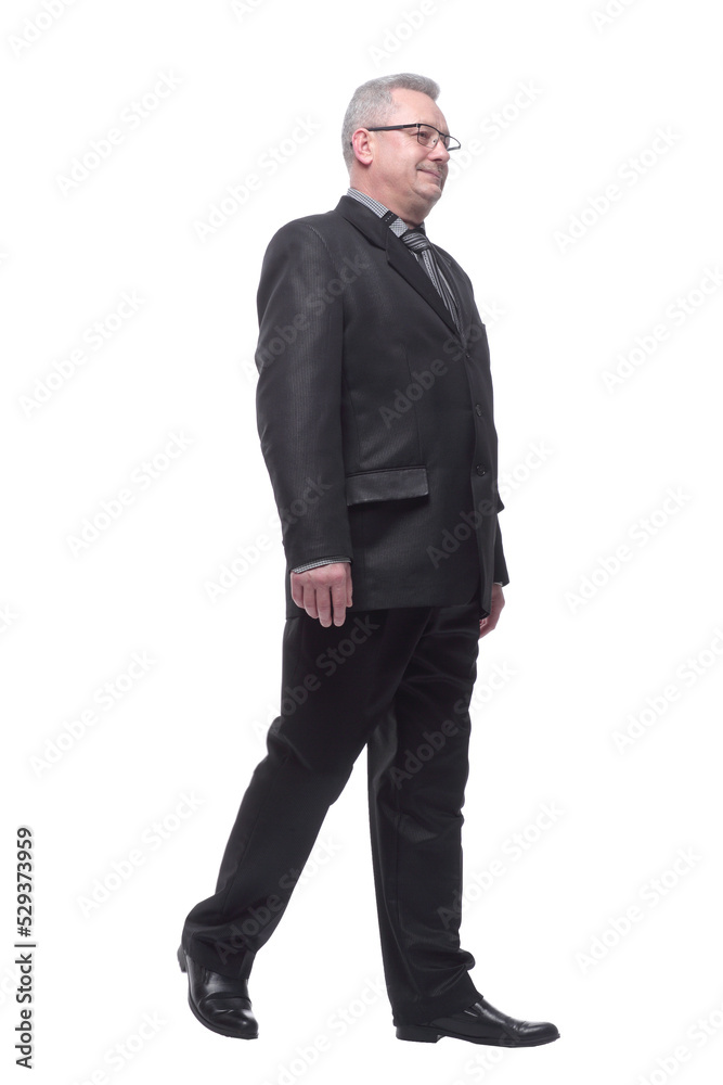 Happy business man smiling and walking and smiling - isolated over a white background Happy business man smiling and walking and smiling - isolated over a white background