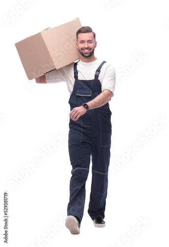 in full growth. smiling man carries a large cardboard box