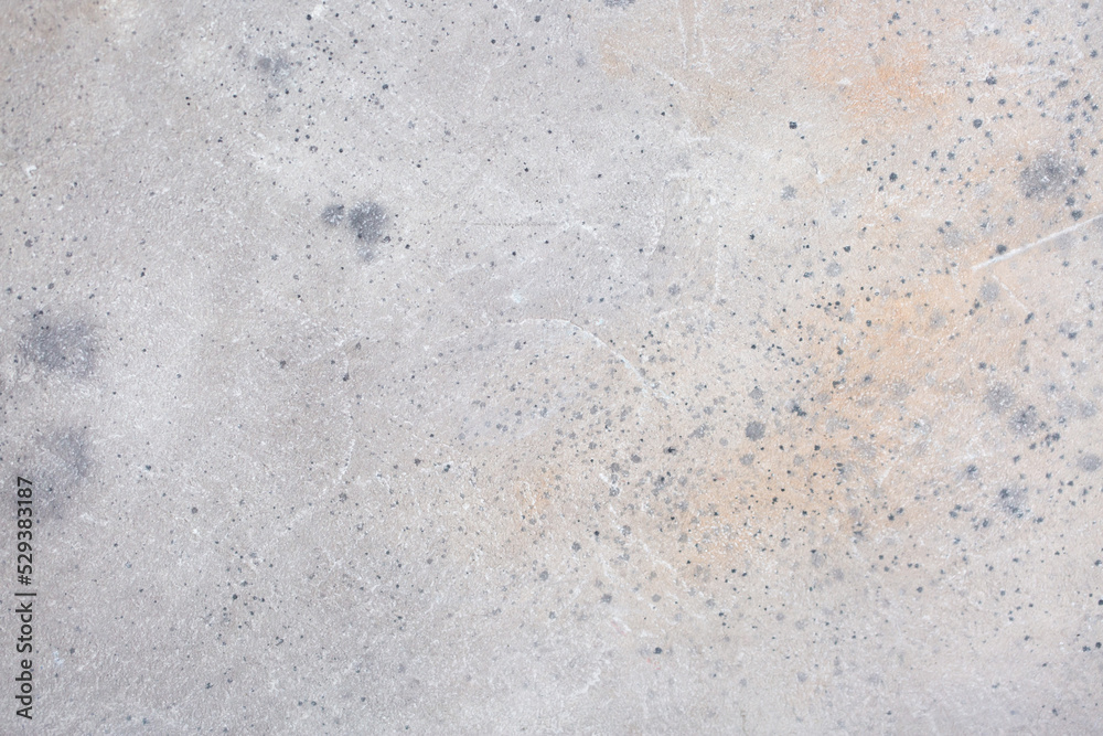 Light background of decorative plaster with abstract spots. Unusual texture of white or gray wall with beautiful patterns, creative surface background. Finishing coating for building cladding. Light background of decorative plaster with abstract spots. Unusual texture of white or gray wall with beautiful patterns, creative surface background. Finishing coating for building cladding.