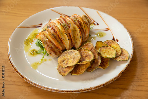 Grilled chicken filet with fried zucchini and arugula
