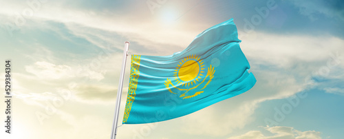 Kazakhstan national flag cloth fabric waving on the sky - Image