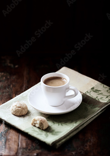 Cup of coffee on dark wooden background. Soft focus. Copy space.