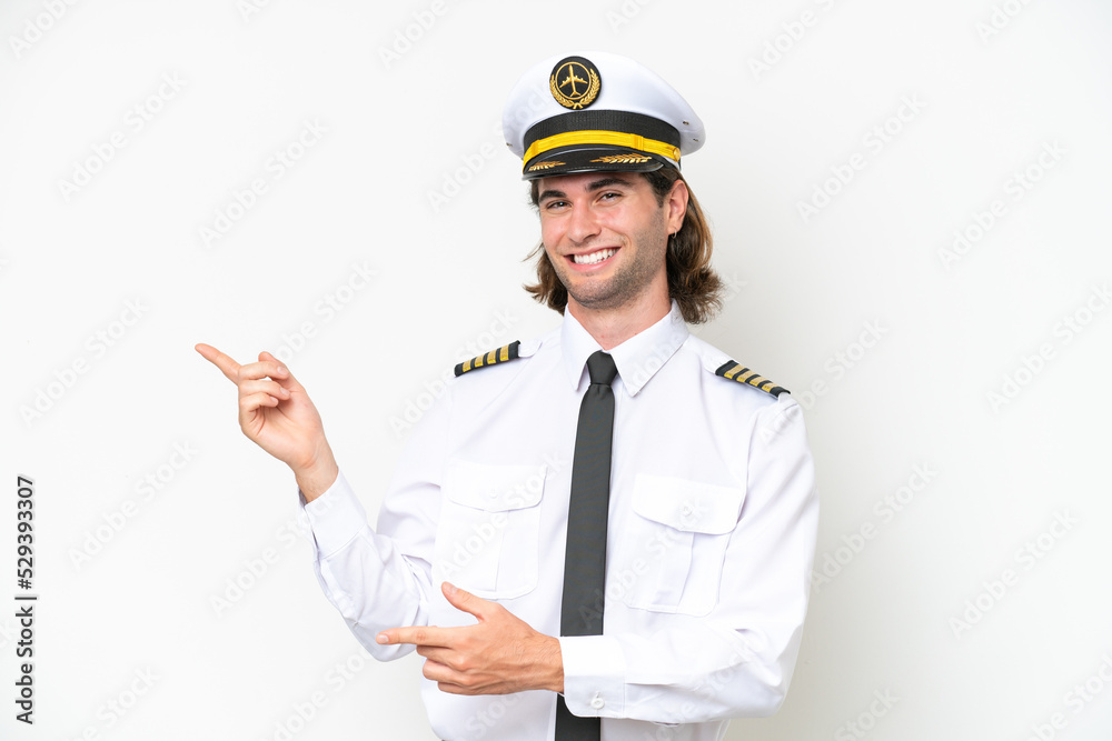 handsome Airplane pilot isolated on white background pointing finger to the side and presenting a product handsome Airplane pilot isolated on white background pointing finger to the side and presenting a product