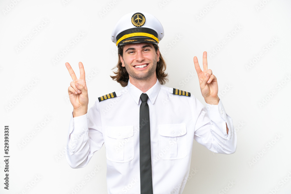 handsome Airplane pilot isolated on white background showing victory sign with both hands handsome Airplane pilot isolated on white background showing victory sign with both hands