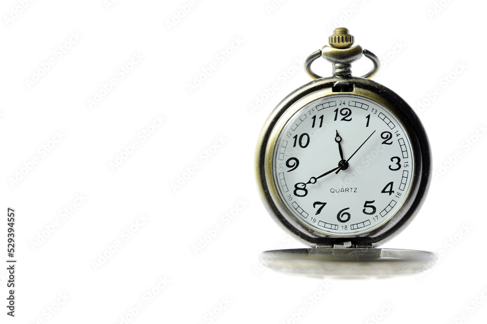 An old pocket watch on a white background An old pocket watch on a white background