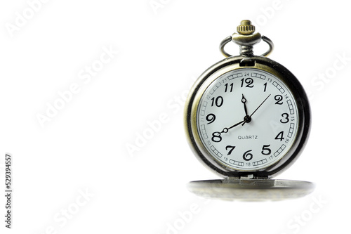 An old pocket watch on a white background