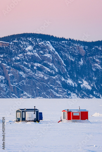 Wallpaper Mural Colorful ice fishing huts on the frozen Saguenay fjord at sunset in La Baie, Quebec (Canada) Torontodigital.ca