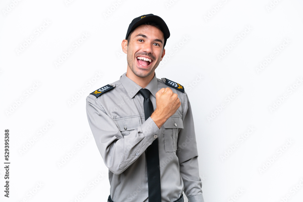 Young safeguard man over isolated white background celebrating a victory