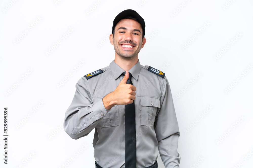 Young safeguard man over isolated white background giving a thumbs up gesture Young safeguard man over isolated white background giving a thumbs up gesture