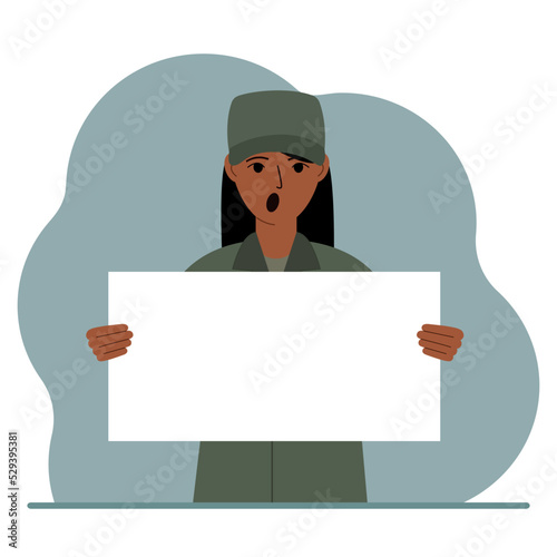 A military man in uniform holds a white sheet of paper in his hands. Concept for advertising, poster, banner.