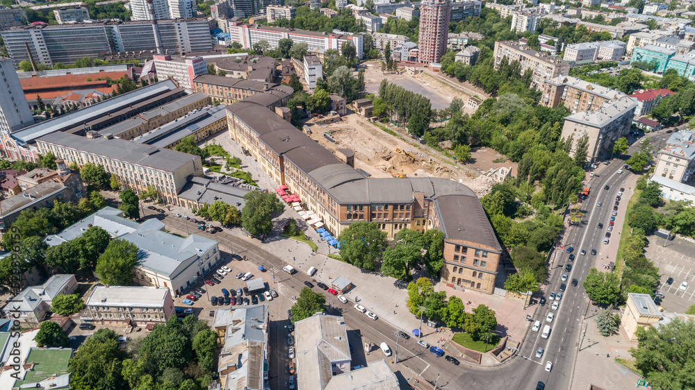 Aerial view building former factory Arsenal. Drone shot beautiful Kyiv Kiev cityscape on a sunny summer day. Capital of Ukraine. Reconstruction