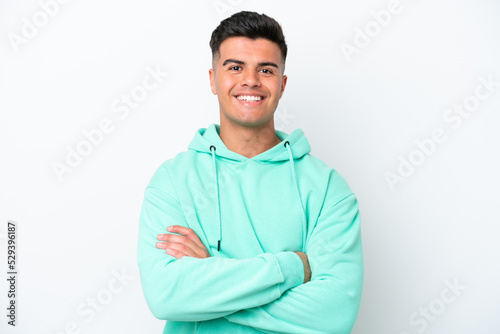 Young caucasian handsome man isolated on white background keeping the arms crossed in frontal position © luismolinero
