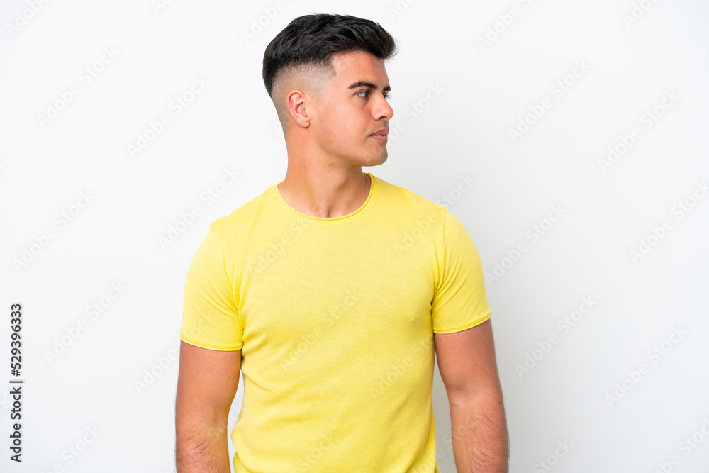 Young caucasian handsome man isolated on white background looking to the side Young caucasian handsome man isolated on white background looking to the side