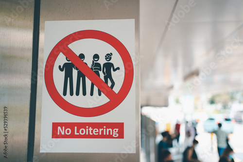 Prohibition Sign No Loitering. No loitering sign for public awareness in Orchard, Singapore.  photo