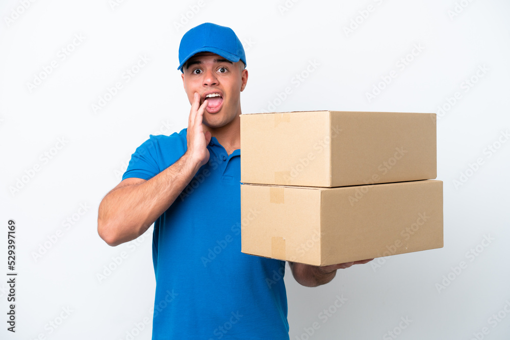 Delivery caucasian man isolated on white background with surprise and shocked facial expression Delivery caucasian man isolated on white background with surprise and shocked facial expression