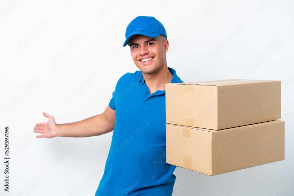 Delivery caucasian man isolated on white background extending hands to the side for inviting to come Delivery caucasian man isolated on white background extending hands to the side for inviting to come