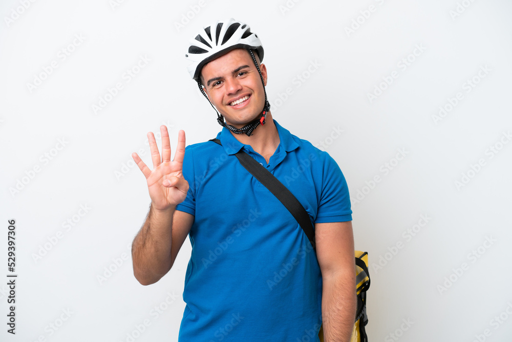 Young caucasian man with thermal backpack isolated on white background happy and counting four with fingers Young caucasian man with thermal backpack isolated on white background happy and counting four with fingers