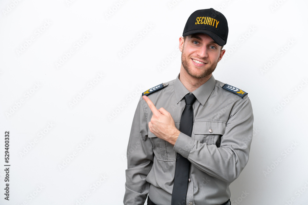 Young safeguard caucasian man isolated on white background pointing to the side to present a product Young safeguard caucasian man isolated on white background pointing to the side to present a product