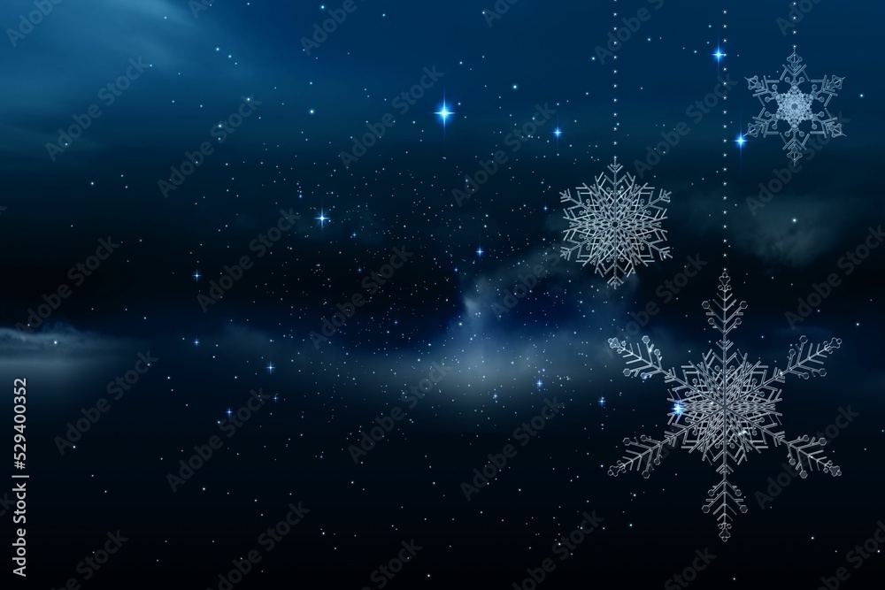 Snowflakes hanging against starry sky Snowflakes hanging against starry sky