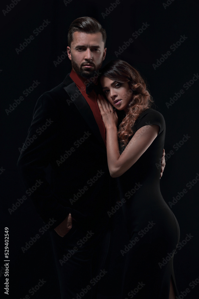 portrait of fashion couple on black background portrait of fashion couple on black background