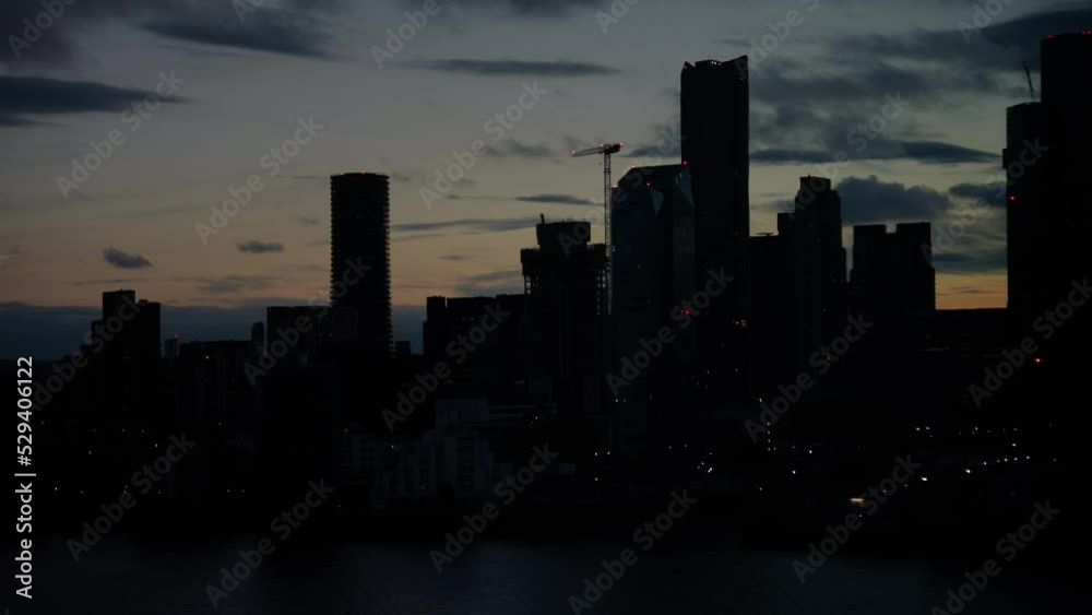 Day to night Time Lapse London Buildings silhouette, modern office skyscrapers by the Thames river Day to night Time Lapse London Buildings silhouette, modern office skyscrapers by the Thames river
