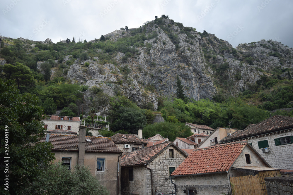 roofs of houses and high mountains in Kotor, Montenegro