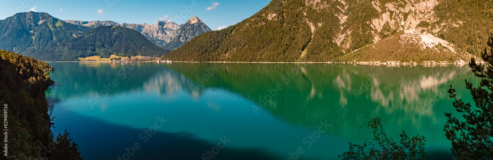 High resolution stitched panorama with reflections at the famous Achensee lake, Tyrol, Austria