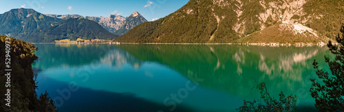 High resolution stitched panorama with reflections at the famous Achensee lake, Tyrol, Austria © Martin Erdniss