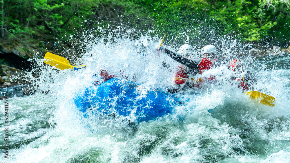 Fototapeta premium Big splash in the rapids during whitewater rafting trip