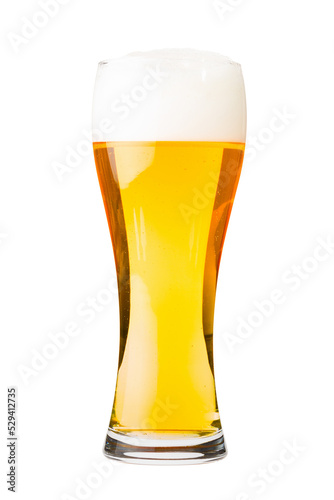 Glass filled with white lager beer with foam