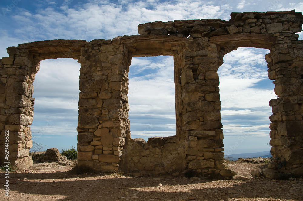 Ruins of an old abandoned village in a natural environment. La Mussara Tarragona, Spain
