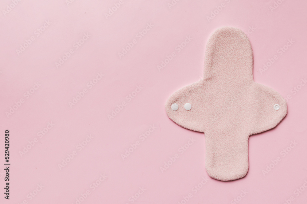 Eco-friendly reusable fabric women's pads. set of colorful bright reusable menstrual pads. zero waste woman periods concept top view with copy space Eco-friendly reusable fabric women's pads. set of colorful bright reusable menstrual pads. zero waste woman periods concept top view with copy space