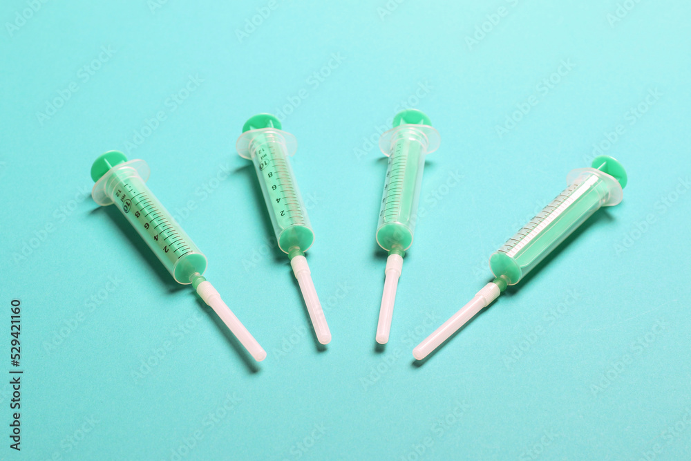 Top view of medical syringes on colorful background. Health care concept with copy space Top view of medical syringes on colorful background. Health care concept with copy space