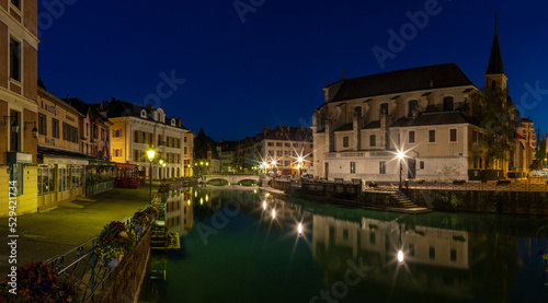 ANNECY, FRANCE - JULY 11, 2022: The old town at dusk with the church Saint Fracois de Sales.