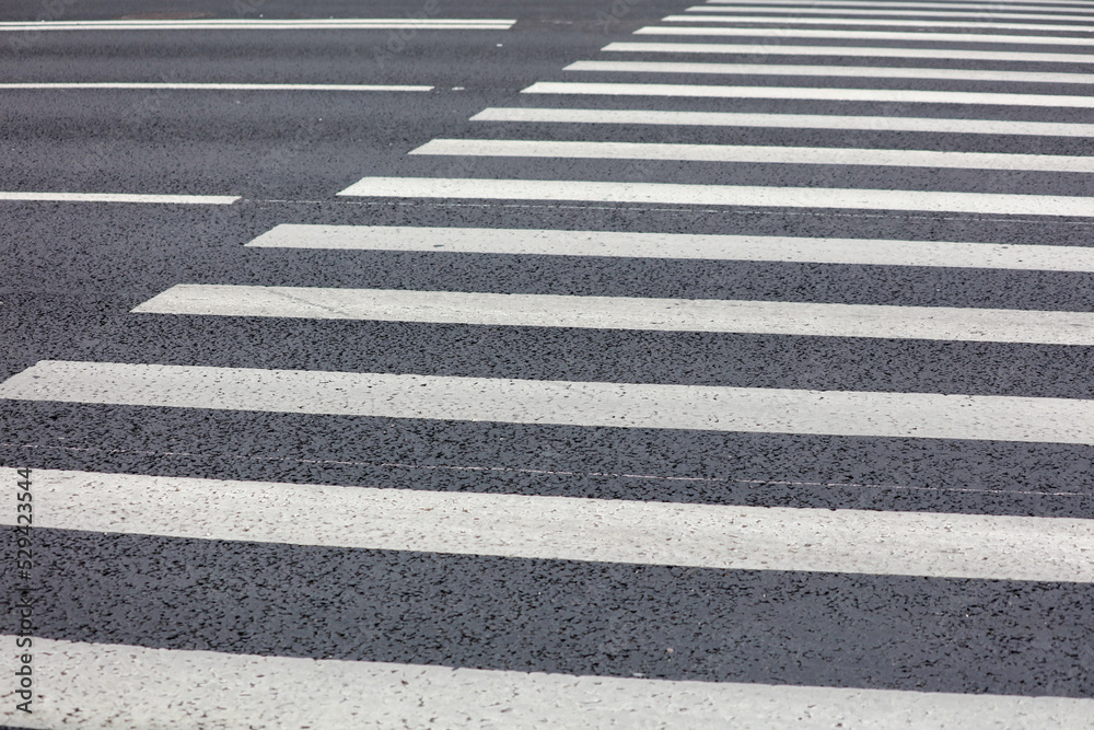 White stripes on the asphalt road. White stripes on the asphalt road.