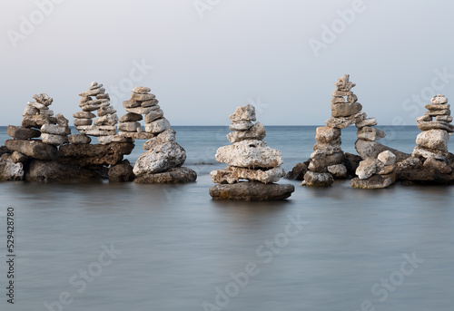 Stones Stacked in Ocean in Greece