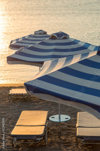 Beach and Ocean with parasols and sunloungers in Faliraki, Rhodes, Greece