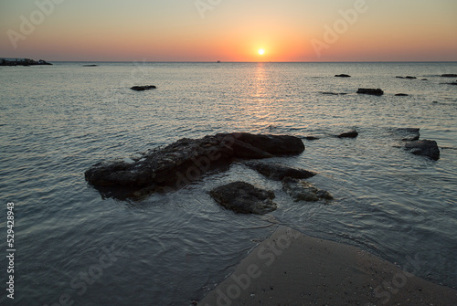 Sunrise over beach in Faliraki, Rhodes, Greece