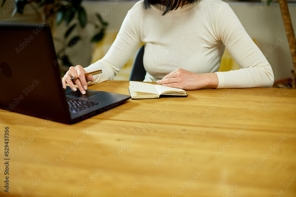 Woman hand making notes in notepad, businesswoman freelancer Woman hand making notes in notepad, businesswoman freelancer