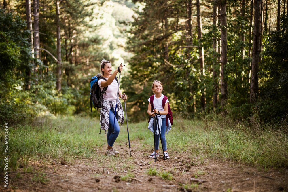 Mother and daughter enjoy hiking together. Mother and daughter enjoy hiking together.