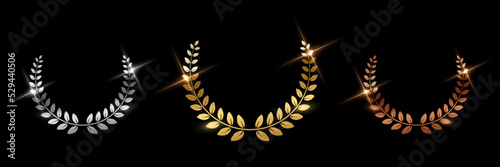 Golden, silver and bronze award signs with laurel wreath isolated on black background. Vector award design templates