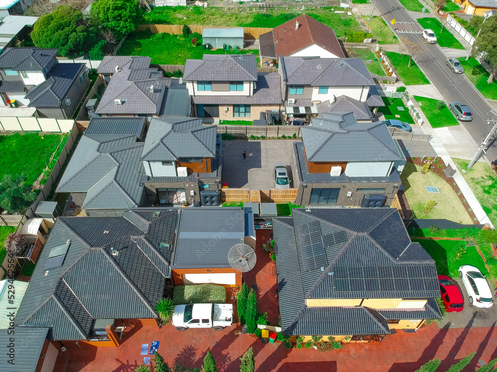 Obraz premium Panoramic Aerial Drone view of Suburban Melbourne housing, roof tops, the streets and the parks NSW Australia
