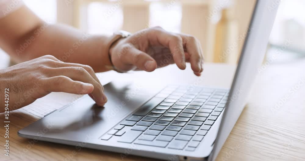 Hands typing email on laptop at desk in house, doing search for movies and video online on the internet and in communication on social media on pc. Business person or man working remote from home