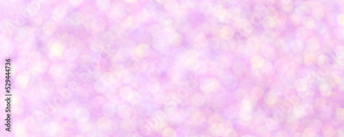 Blurred light lilac sparkling background from small sequins, macro. Diamond pink defocused backdrop